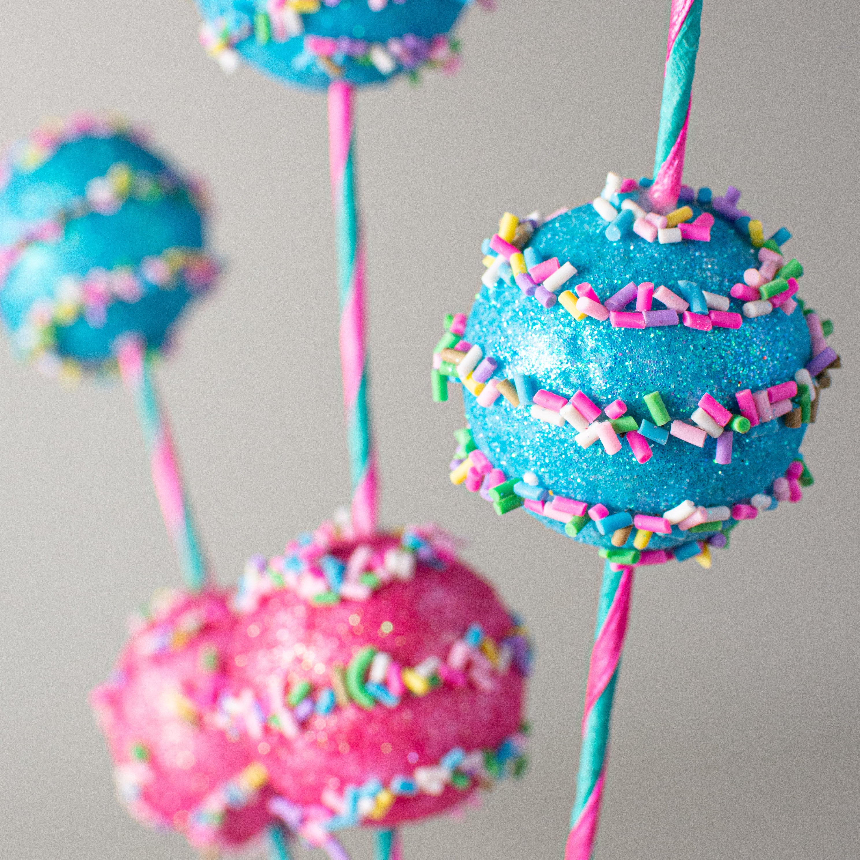 27" Glitter Cake Pop Sprinkle Spray: Pink & Blue